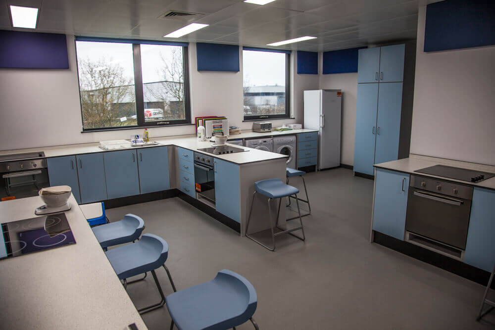 Antimicrobial lighting panels within a commercial kitchen area.